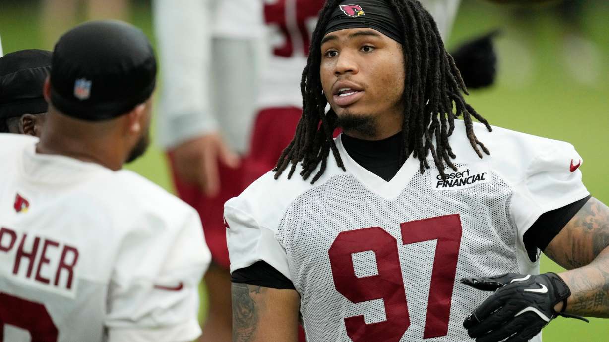 Arizona Cardinals defensive tackle Walter Nolen III (97) talks with Cardinals defensive tackle PJ Mustipher during NFL football training camp, Sunday, July 26, 2026, in Glendale, Ariz.