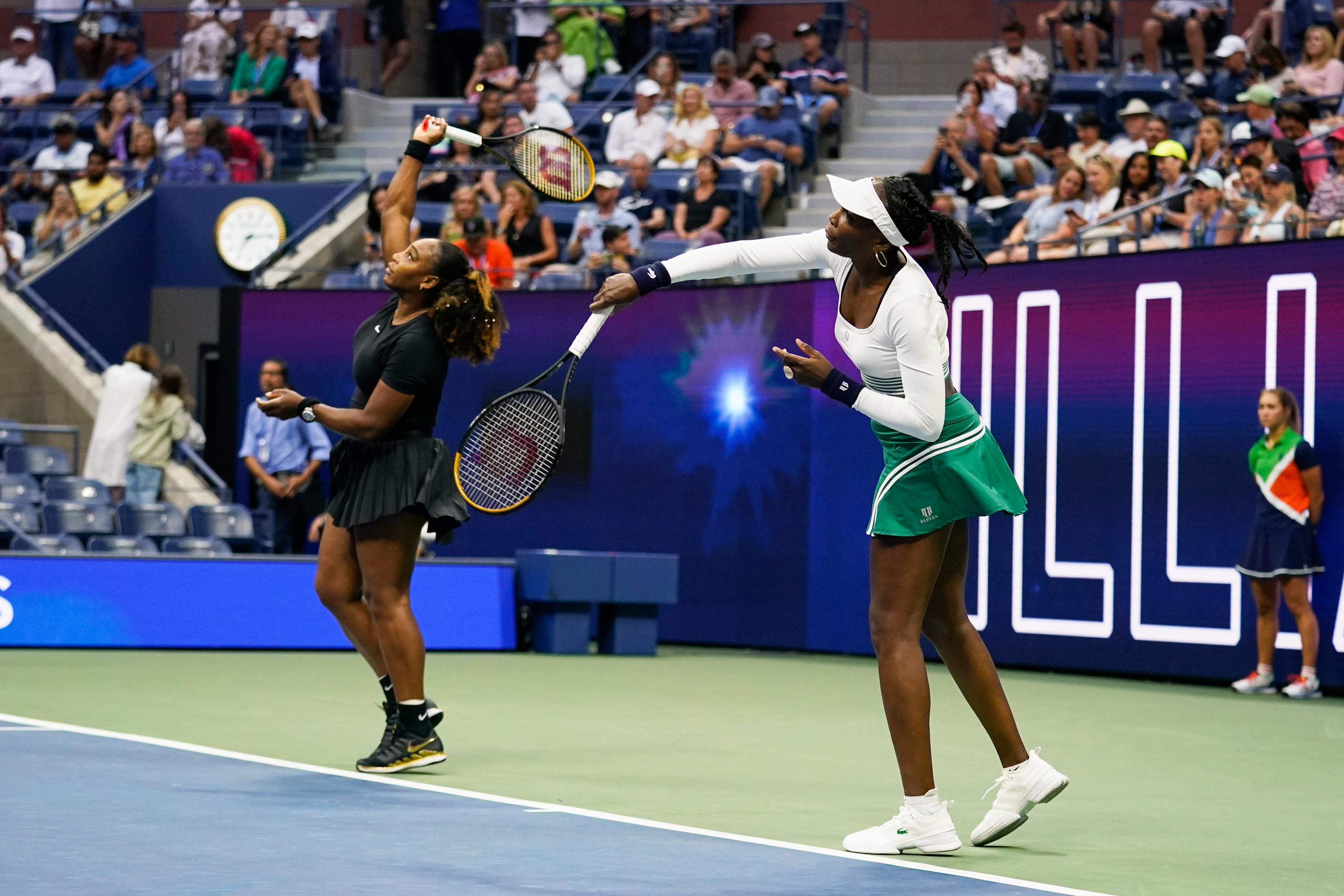 FILE - Serena Williams, left, and Venus Williams, of the United States, warm up before their first-round doubles match against Lucie Hradecká and Linda Nosková, of the Czech Republic, at the U.S. Open tennis championships, Sept. 1, 2022, in New York. 