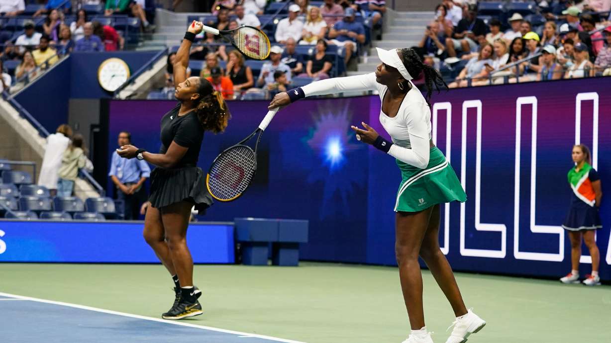 FILE - Serena Williams, left, and Venus Williams, of the United States, warm up before their first-round doubles match against Lucie Hradecká and Linda Nosková, of the Czech Republic, at the U.S. Open tennis championships, Sept. 1, 2022, in New York.