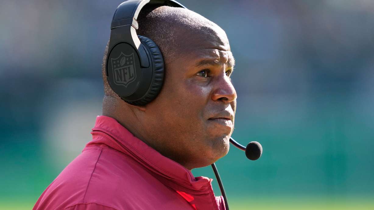 FILE - Washington Commanders offensive coordinator Eric Bieniemy watches from the sidelines during an NFL football game, Oct. 1, 2023, in Philadelphia.