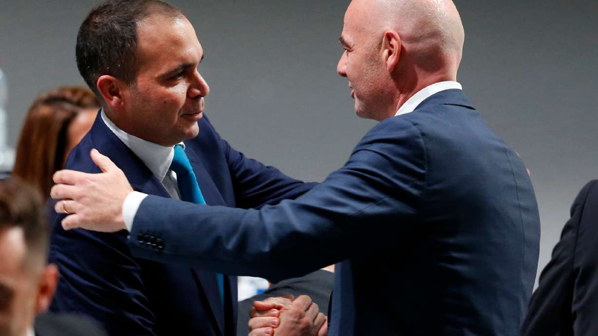 FILE - Newly elected FIFA President Gianni Infantino, of Switzerland, right, is congratulated by fellow candidate Prince Ali Al-Hussein, of Jordan, left, after the second election round during the extraordinary FIFA congress in Zurich, Switzerland, Feb. 26, 2016.