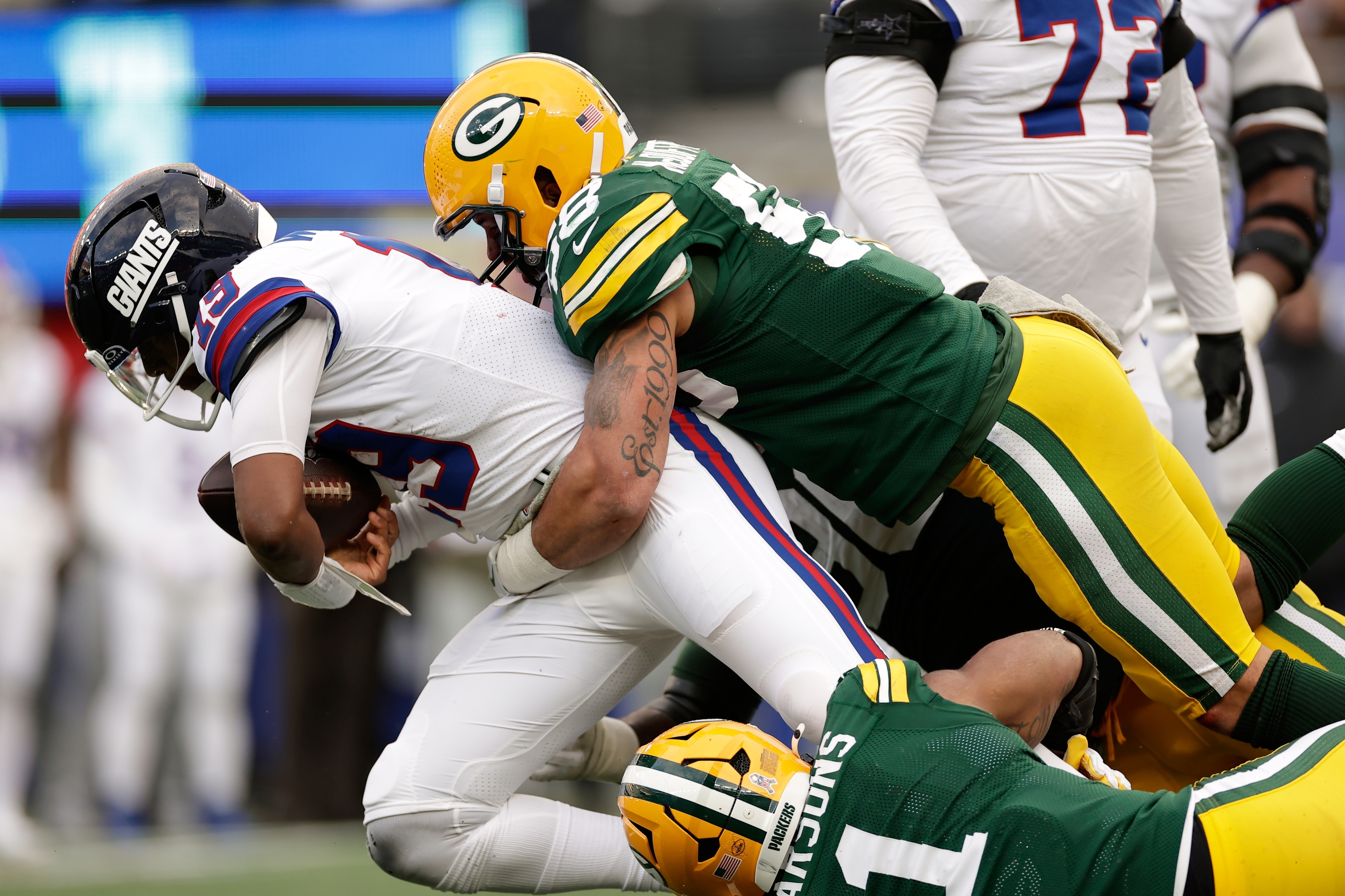 FILE - Green Bay Packers' Micah Parsons and Isaiah McDuffie sack New York Giants' Jameis Winston during the second half of an NFL football game, Nov. 16, 2025, in East Rutherford, N.J. 