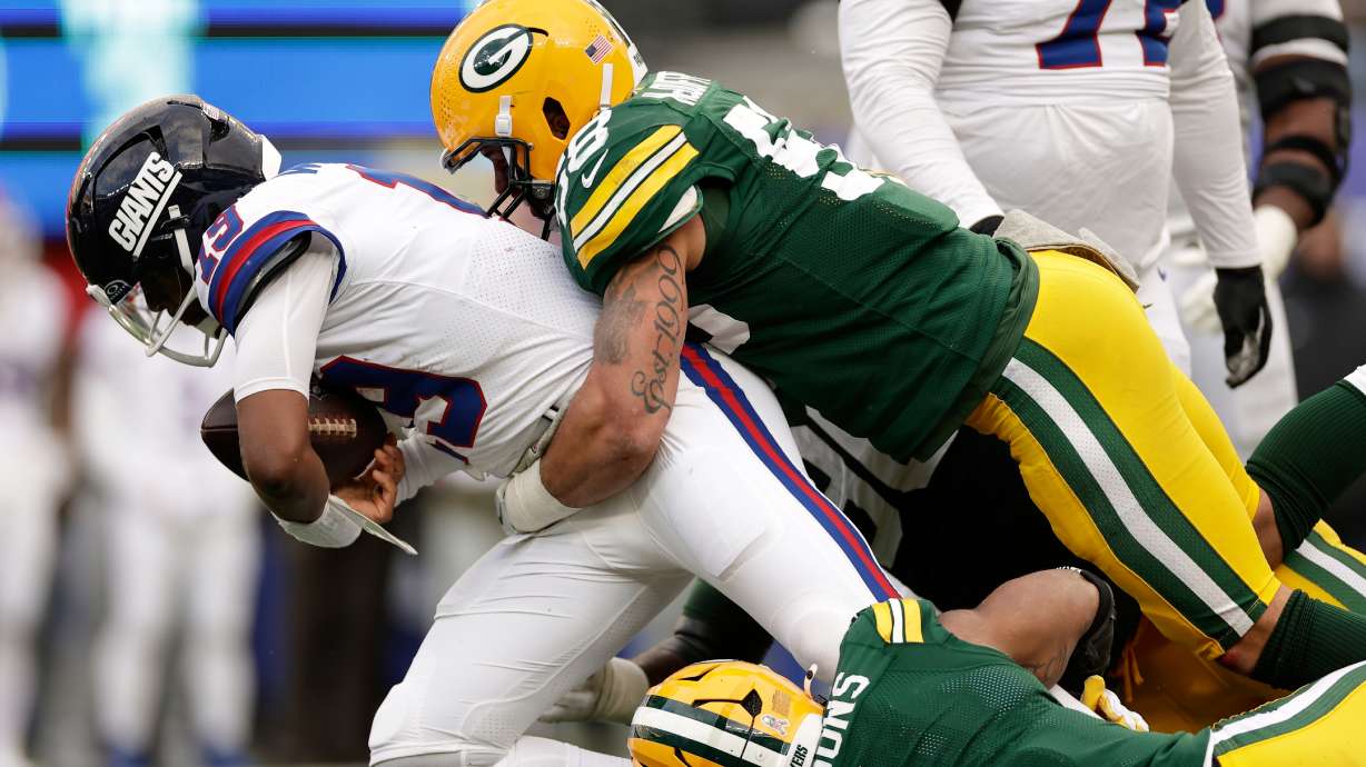FILE - Green Bay Packers' Micah Parsons and Isaiah McDuffie sack New York Giants' Jameis Winston during the second half of an NFL football game, Nov. 16, 2025, in East Rutherford, N.J.