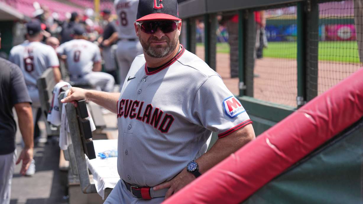 Cleveland Guardians manager Stephen Vogt stands in the dugout before the first baseball game of a doubleheader against the Cincinnati Reds, Tuesday, July 28, 2026, in Cincinnati.