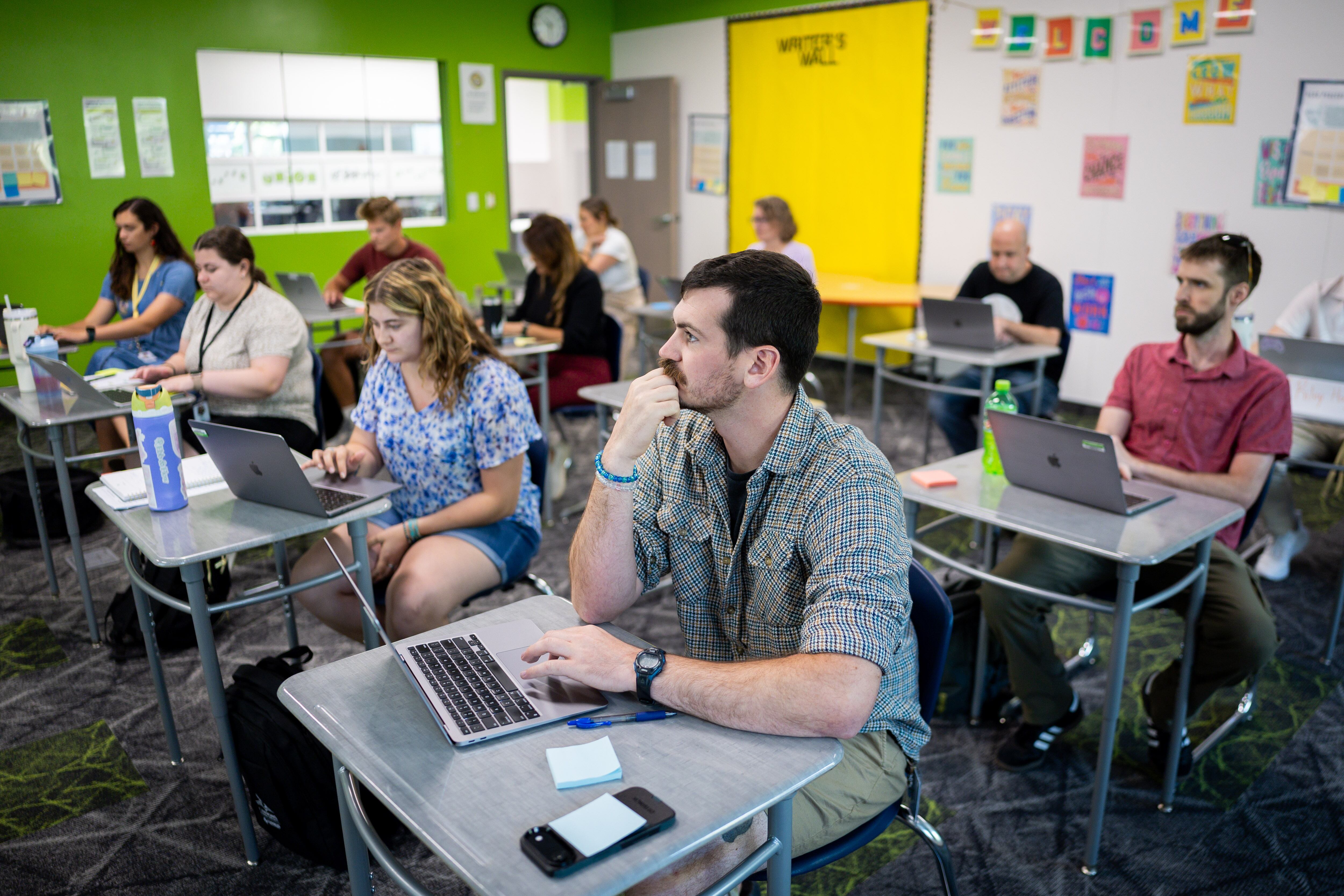 New teacher Cody Wright and others participate in new teacher training at Union Middle School in Sandy on Tuesday. Teachers are entering the classroom at a critical point in education.