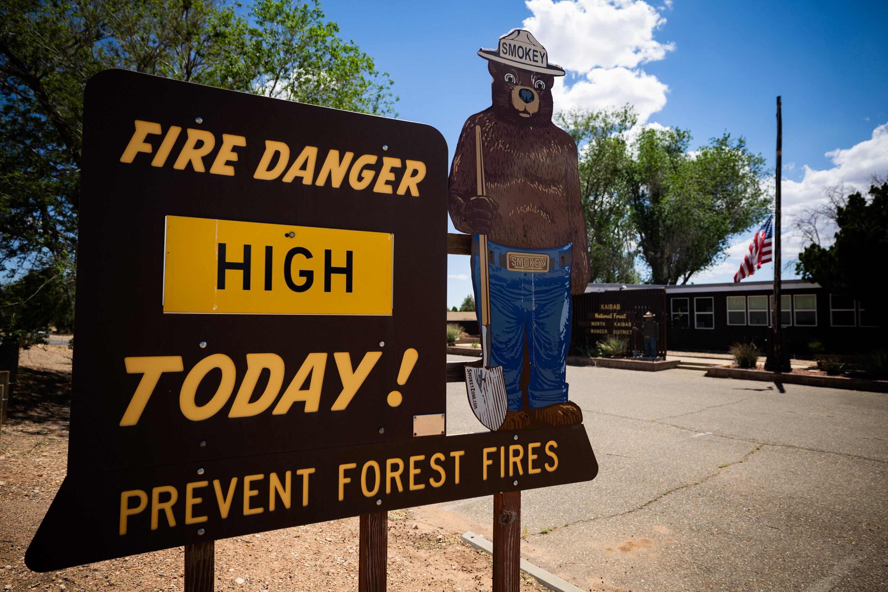 A sign indicating fire danger is located outside the Kaibab National Forest North Kaibab Ranger District office in Fredonia, Ariz., on May 16. Senators are pushing to get the Fix Our Forests Act over the finish line.
