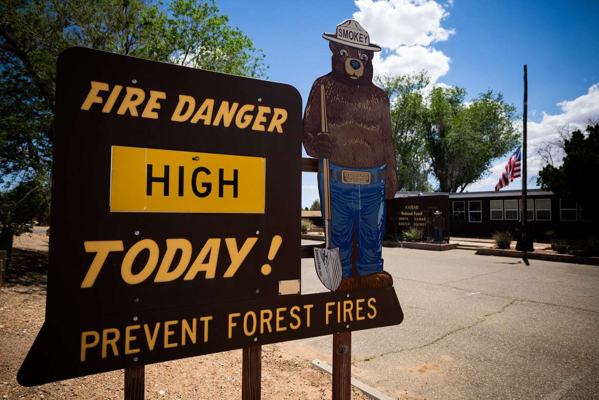 A sign indicating fire danger is located outside the Kaibab National Forest North Kaibab Ranger District office in Fredonia, Ariz., on May 16. Senators are pushing to get the Fix Our Forests Act over the finish line.