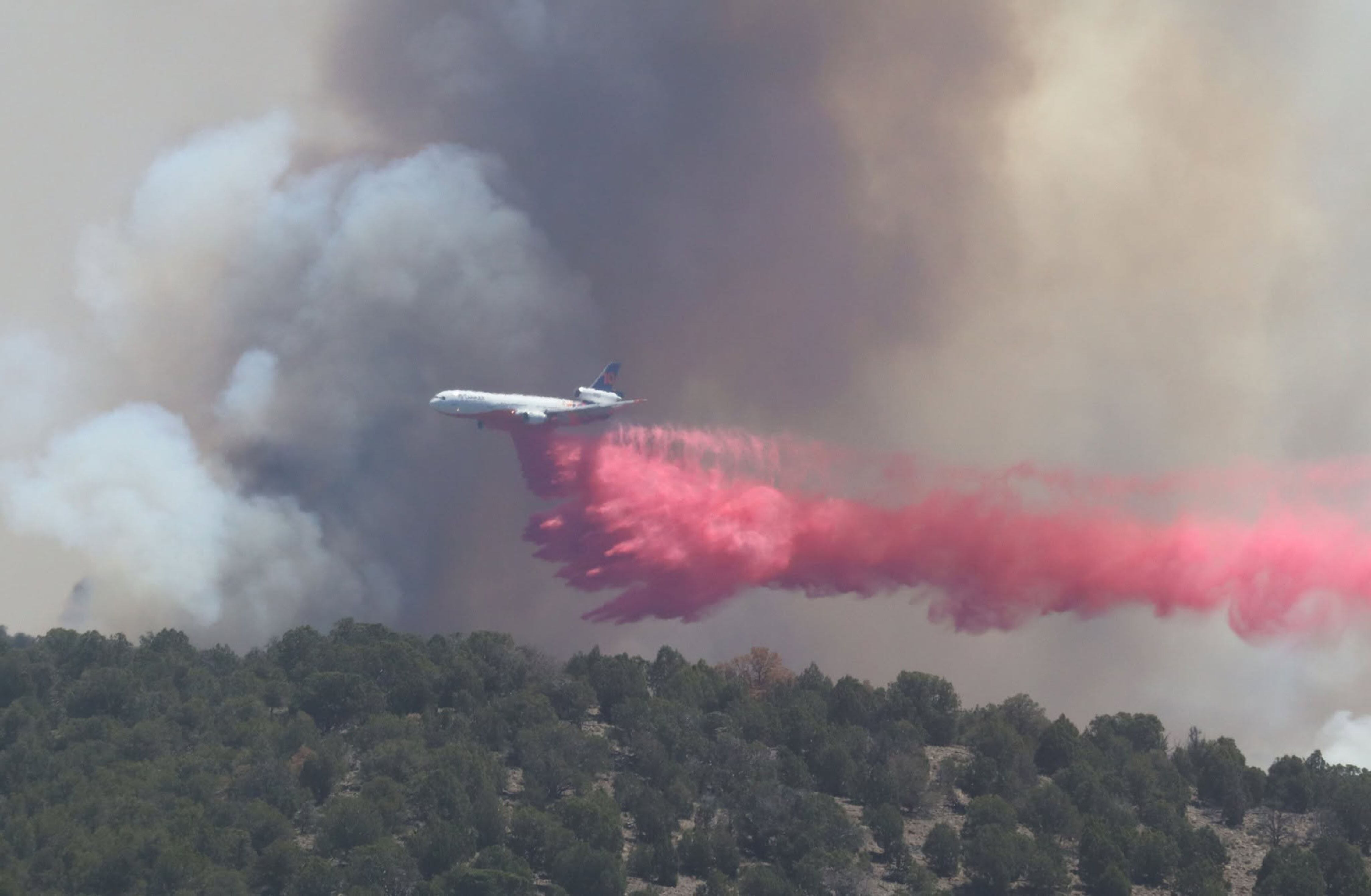 A plane does a retardant drop on the Cottonwood Fire in the Fishlake National Forest on June 23. The fire is one of several torching the Western U.S. in a record-breaking fire season.