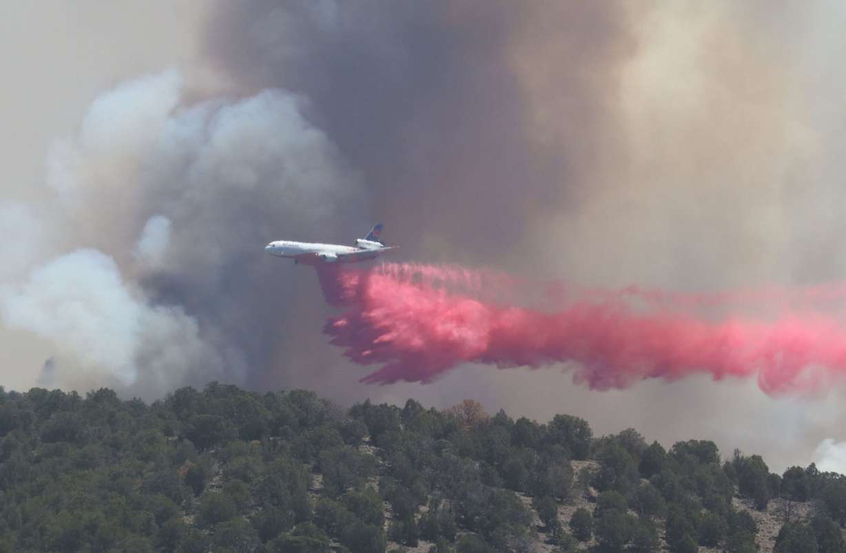 A plane does a retardant drop on the Cottonwood Fire in the Fishlake National Forest on June 23. The fire is one of several torching the Western U.S. in a record-breaking fire season.