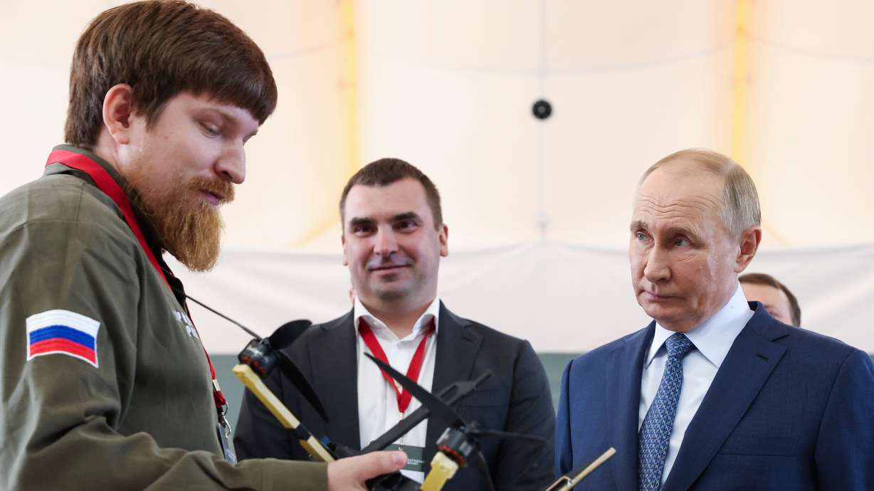 Russian President Vladimir Putin speaks with Vladimir Tkachuk, the head of the Uraldronzavod, during his visit to the Special Technology Centre in St. Petersburg, Sept. 19, 2024. Tkachuk was badly wounded in a car explosion on Wednesday.