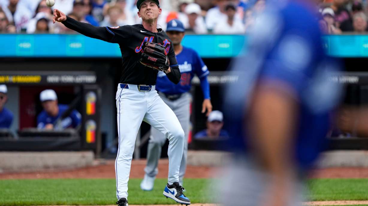 New York Mets pitcher Luke Weaver throws out Los Angeles Dodgers' Teoscar Hernández at first base during the eighth inning of a baseball game, Sunday, July 26, 2026, in New York.
