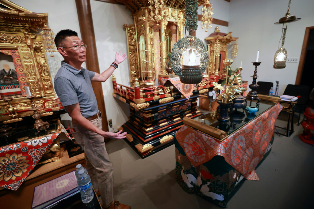 Troy Watanabe, Salt Lake Buddhist Temple president, minister’s assistant, teacher and scout leader, shows the naijin at the Salt Lake Buddhist Temple in Salt Lake City on Aug. 4.