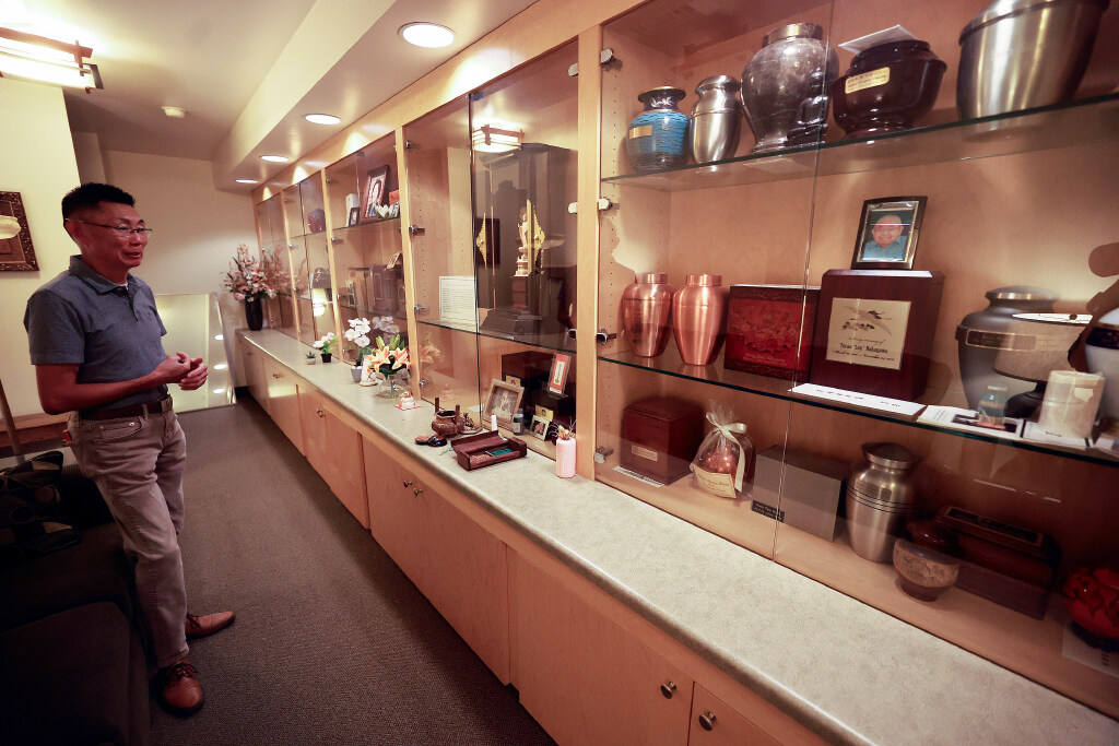 Troy Watanabe, Salt Lake Buddhist Temple president, minister’s assistant, teacher and scout leader, shows the nokotsudo, where the ashes of deceased members or members’ families, as well as ashes of early Japanese immigrants who didn’t have local family, are kept at the Salt Lake Buddhist Temple in Salt Lake City on Aug. 4.