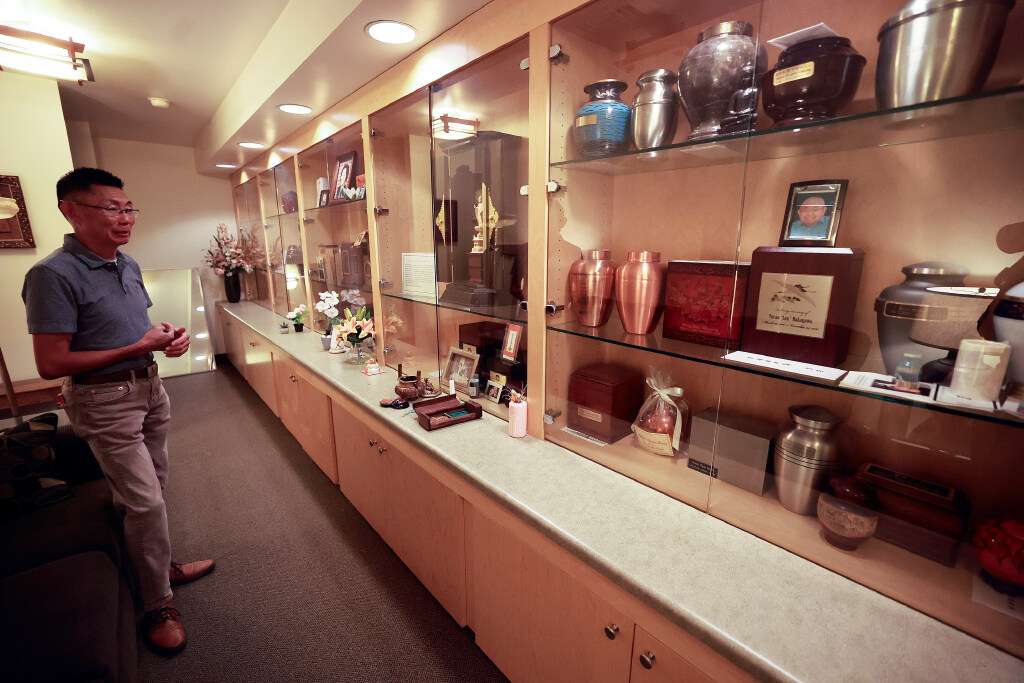 Troy Watanabe, Salt Lake Buddhist Temple president, minister’s assistant, teacher and scout leader, shows the nokotsudo, where the ashes of deceased members or members’ families, as well as ashes of early Japanese immigrants who didn’t have local family, are kept at the Salt Lake Buddhist Temple in Salt Lake City on Aug. 4.