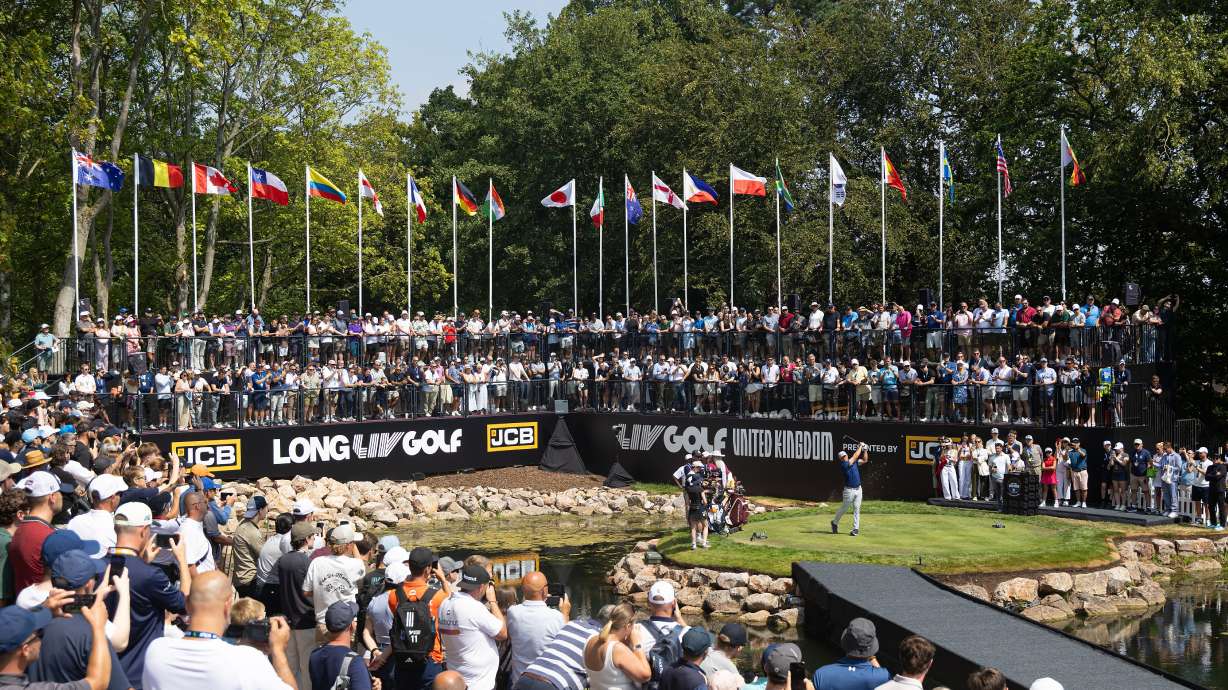 Captain Bryson DeChambeau, center right, of Crushers GC hits from the first tee during the second round of LIV Golf United Kingdom, Friday, July 24, 2026, in Rocester, England.