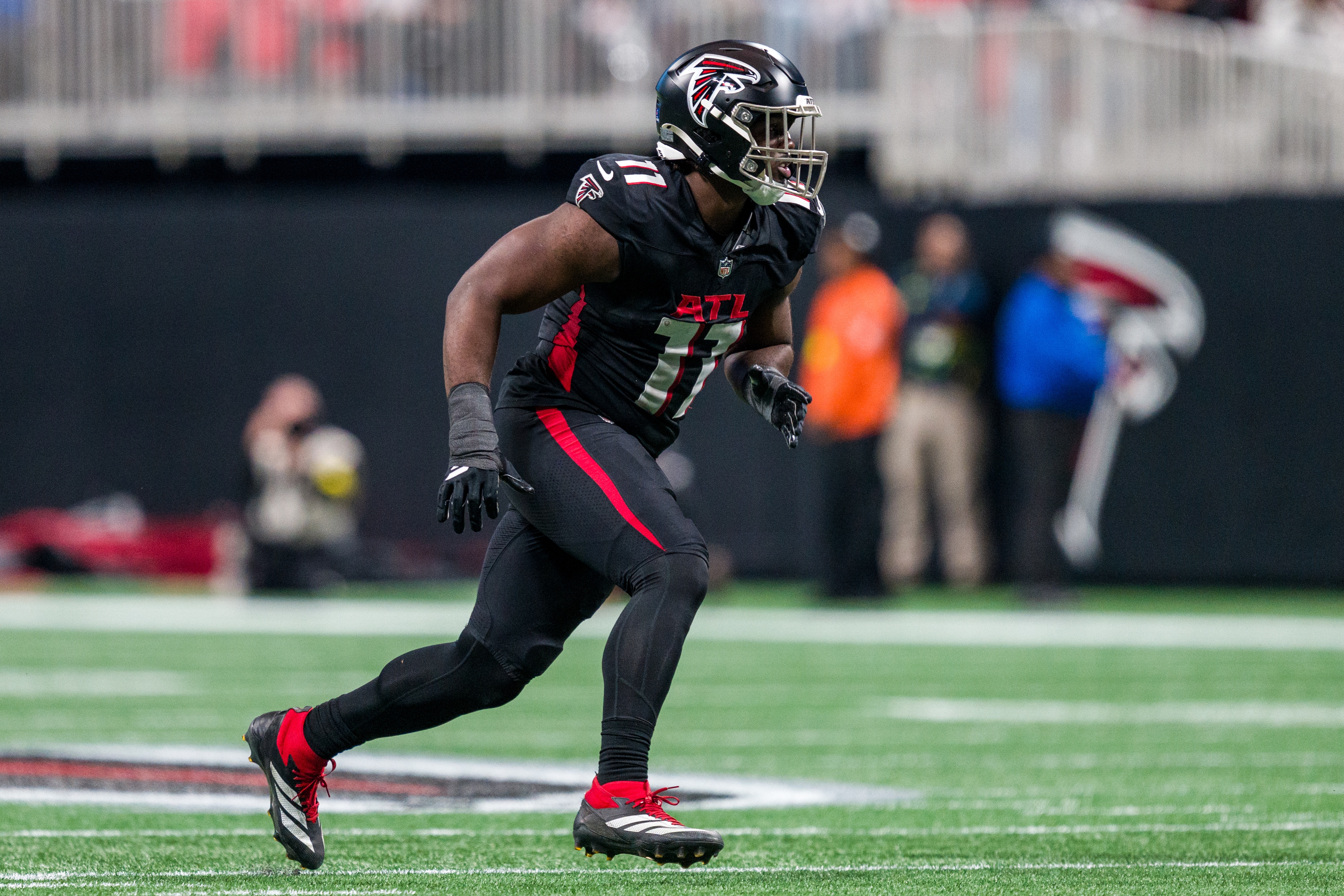 File- Atlanta Falcons linebacker Jalon Walker (11) works during the first half of an NFL football game against the New Orleans Saints, Sunday, Jan. 4, 2026, in Atlanta. 