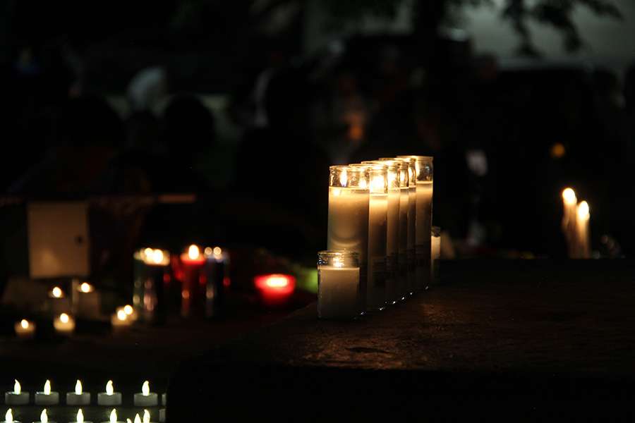 Candles at the candlelight vigil for the victims of the In-N-Out shooting at the Twin Falls City Park in Idaho, Tuesday. Many religious leaders also attended the vigil.