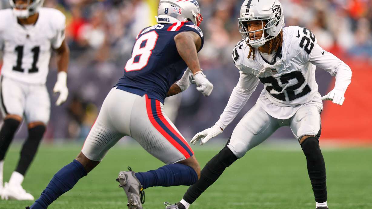 FILE - Las Vegas Raiders cornerback Eric Stokes (22) covers New England Patriots wide receiver Stefon Diggs (8) during the second half of an NFL football game Sept. 7, 2025, in Foxborough, Mass.
