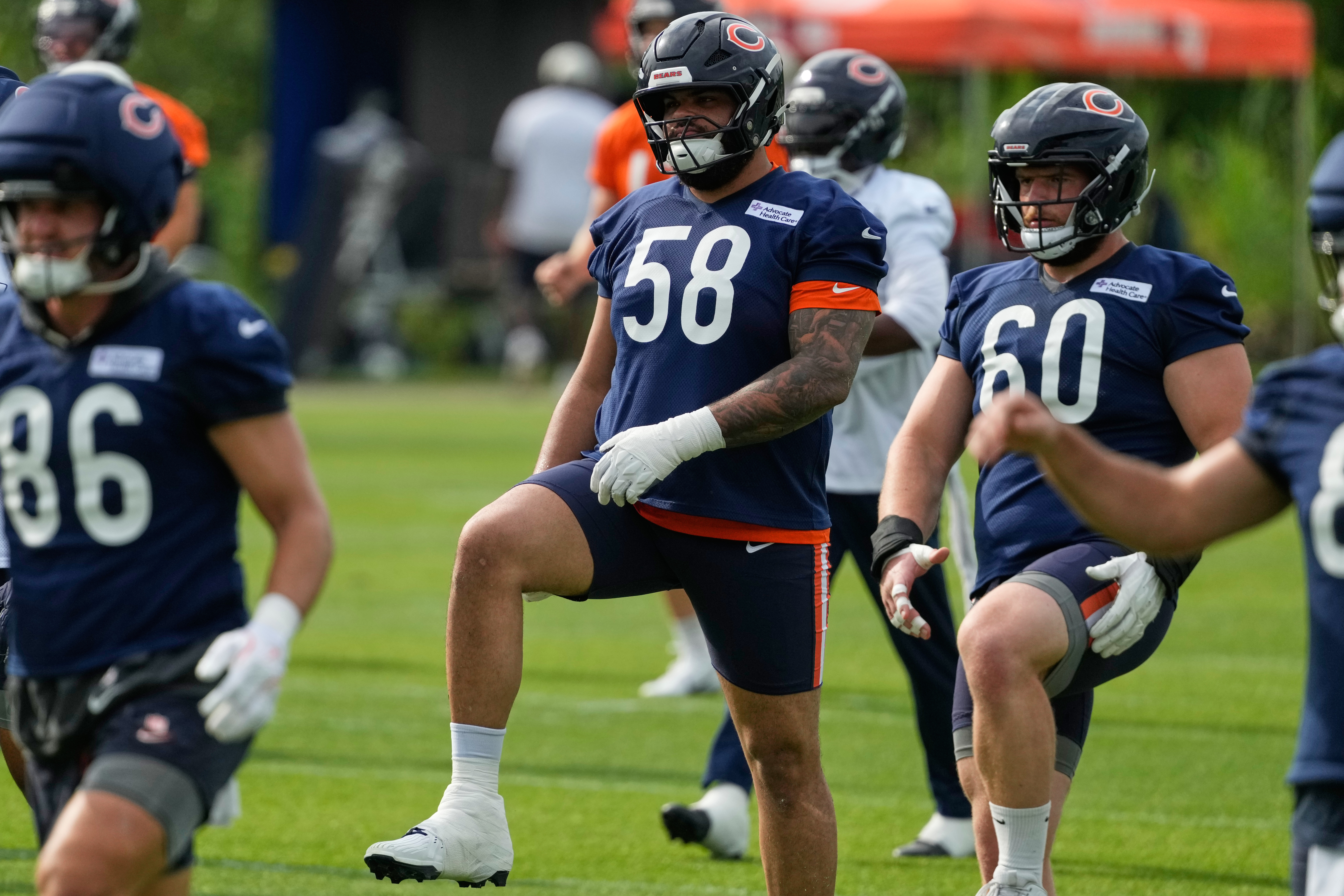 Chicago Bears offensive line Darnell Wright warms up during practice at the team's NFL football training camp, Friday, July 31, 2026, in Lake Forest, Ill. 