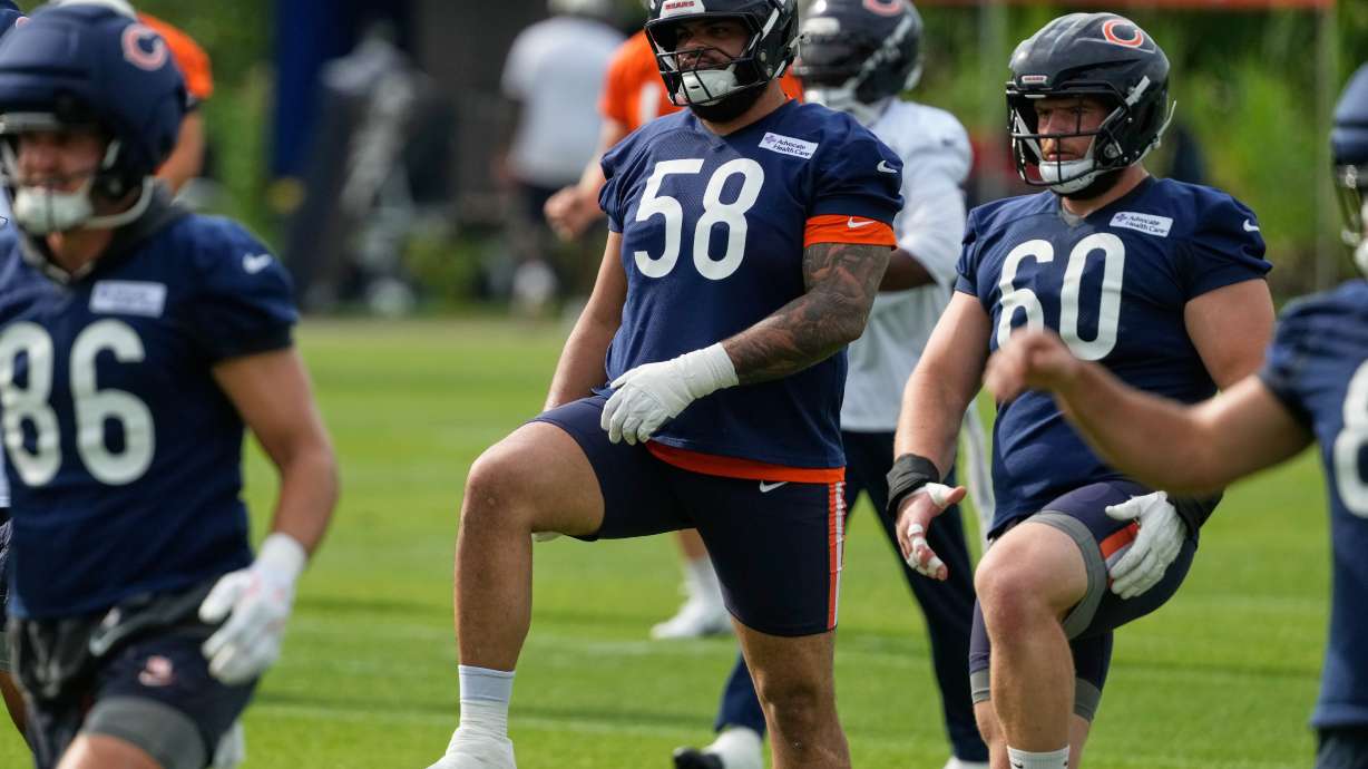 Chicago Bears offensive line Darnell Wright warms up during practice at the team's NFL football training camp, Friday, July 31, 2026, in Lake Forest, Ill.