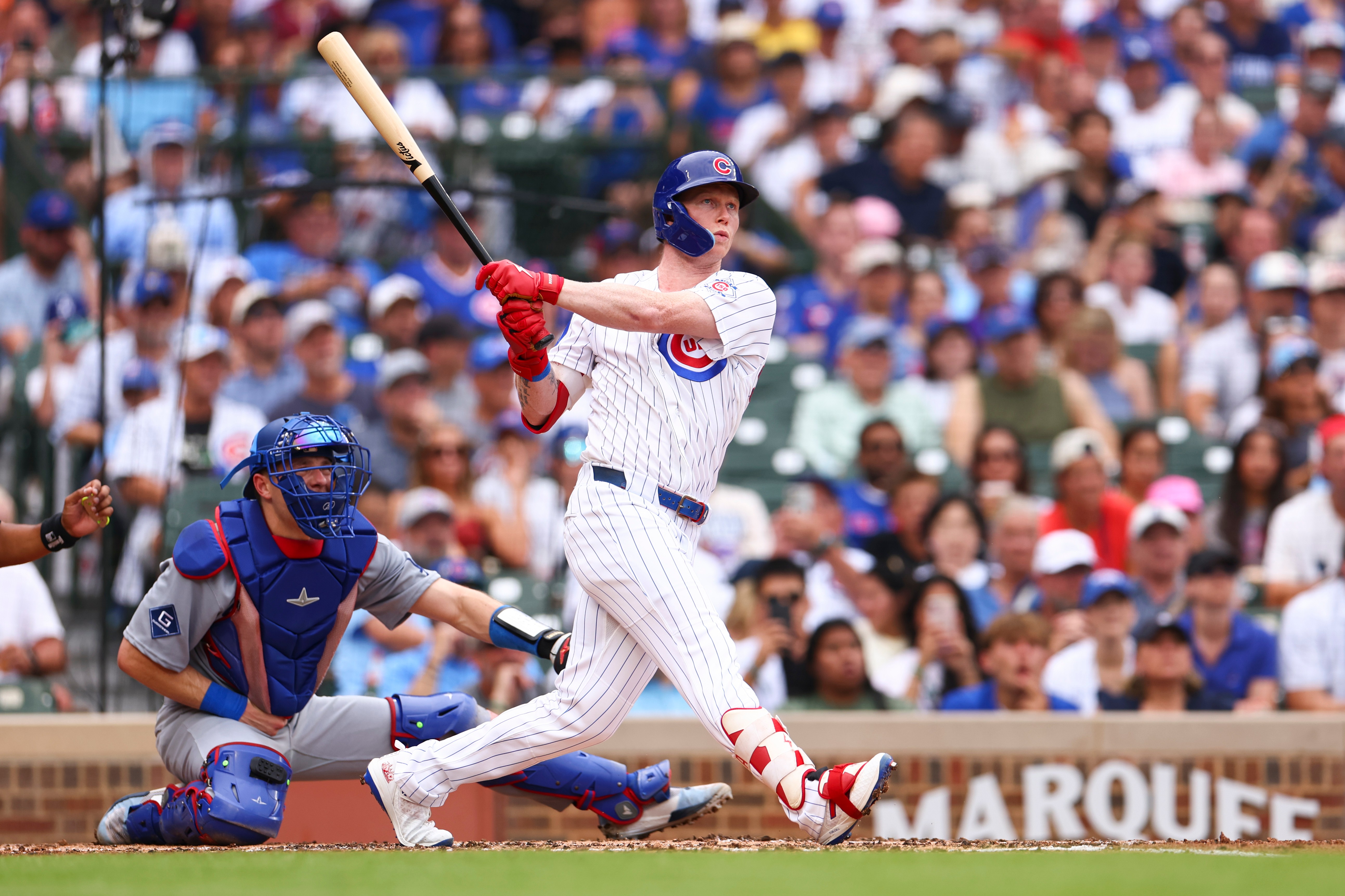Chicago Cubs designated hitter Pete Crow-Armstrong follows through on an RBI double during the second inning of a baseball game against the Los Angeles Dodgers in Chicago, Wednesday, Aug. 5, 2026. 
