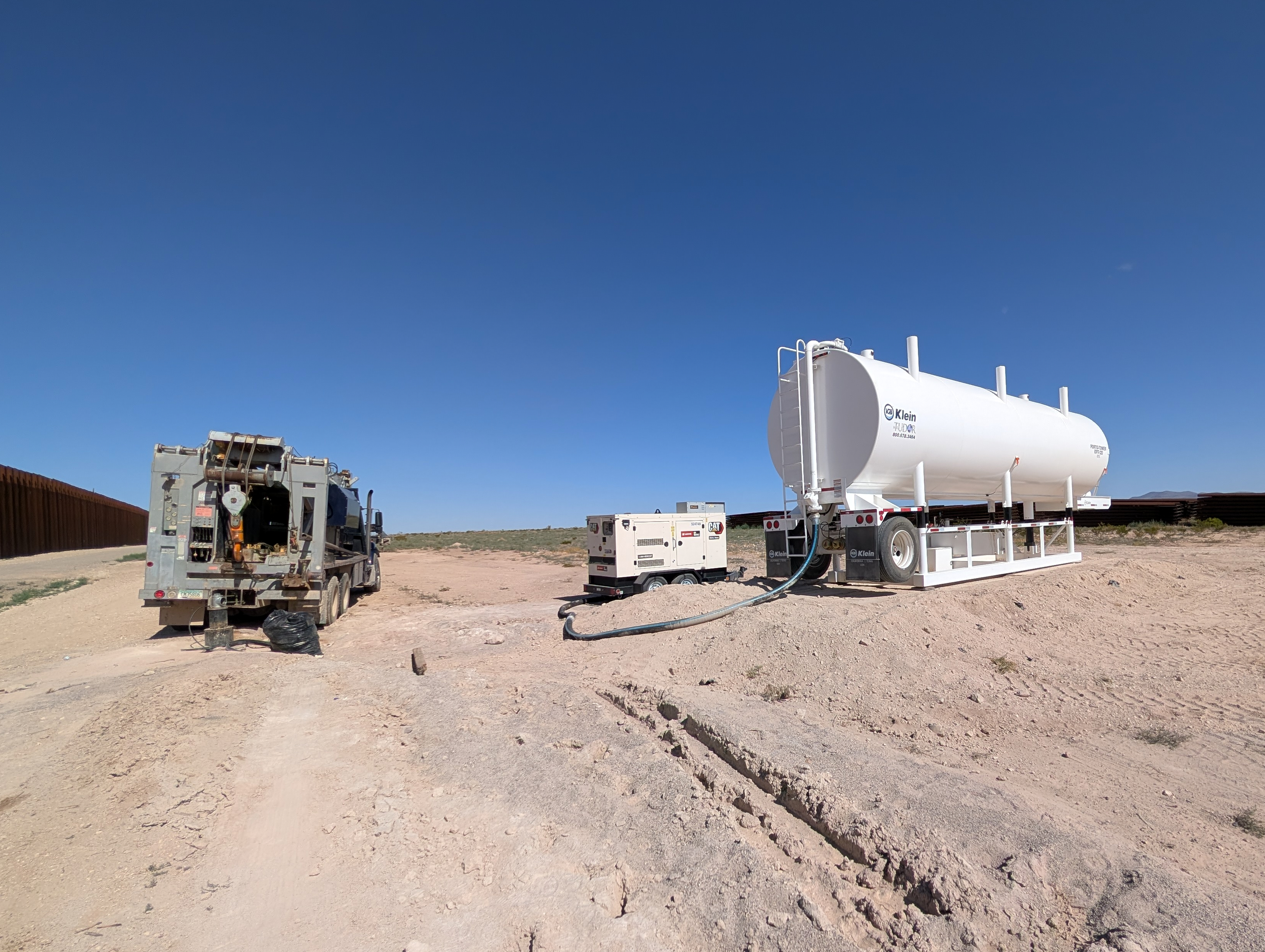 Construction crews drill wells for border wall construction in July in Luna County, N.M., along the US-Mexico border.