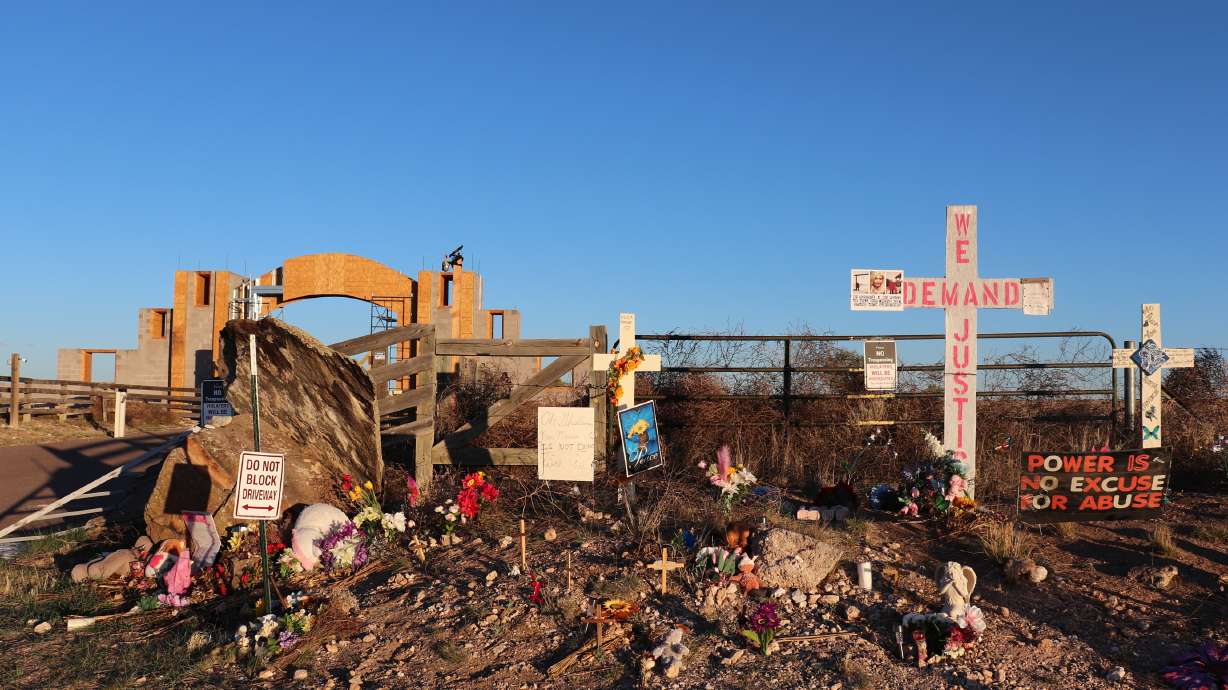 Crosses, flowers and other mementos are displayed outside Jeffrey Epstein's former Zorro Ranch near Stanley, N.M., on April 3. New Mexico's attorney general is suing Epstein's attorney and accountant, accusing of concealing Epstein's sex trafficking operation at his ranch near Santa Fe.