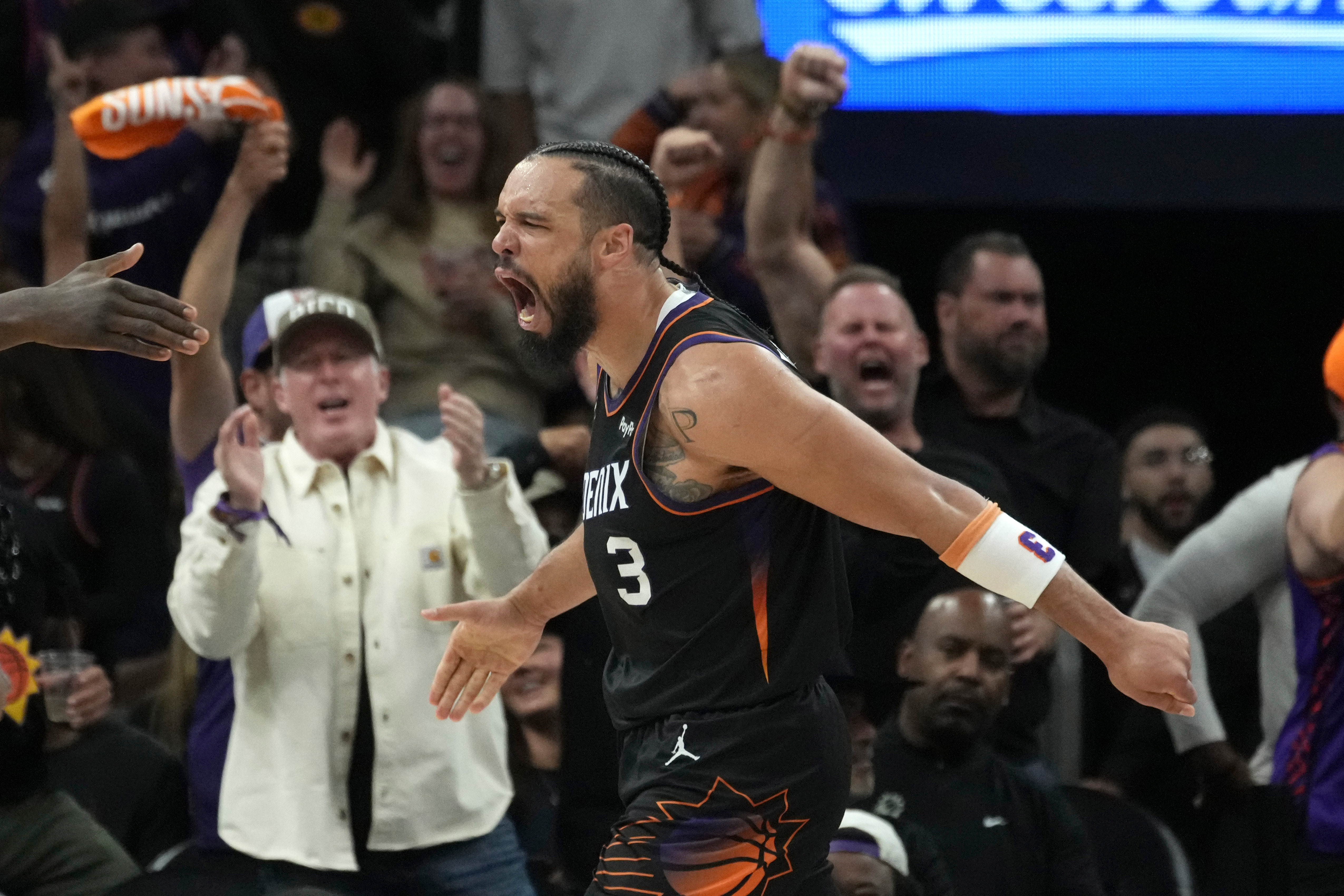 FILE - Phoenix Suns forward Dillon Brooks celebrates his score and being fouled during the second half of Game 4 in a first-round NBA playoffs basketball series against the Oklahoma City Thunder, Monday, April 27, 2026, in Phoenix. 