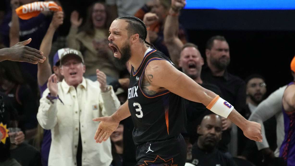 FILE - Phoenix Suns forward Dillon Brooks celebrates his score and being fouled during the second half of Game 4 in a first-round NBA playoffs basketball series against the Oklahoma City Thunder, Monday, April 27, 2026, in Phoenix.