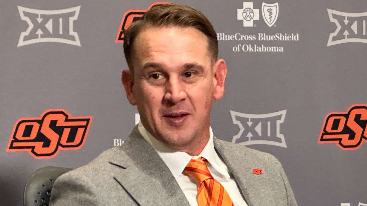 FILE - Eric Morris attends a news conference introducing him as the new head coach of the Oklahoma State NCAA college football team, Dec. 8, 2025 in Stillwater, Okla.