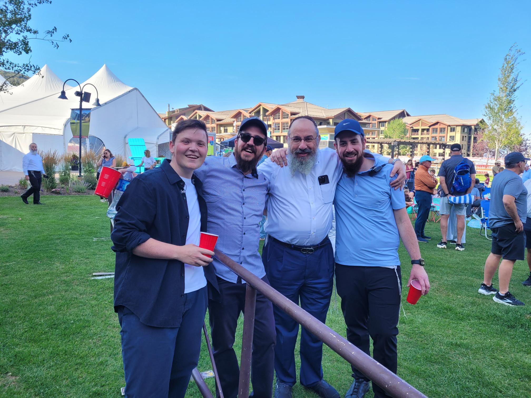 From left to right, Chaim Zippel, Rabbi Avremi Zippel, Rabbi Benny Zippel and Rabbi Chaim Zippel pose for a photograph on Wednesday shortly before Chaim Zippel performs at the Park City Jewish Festival.