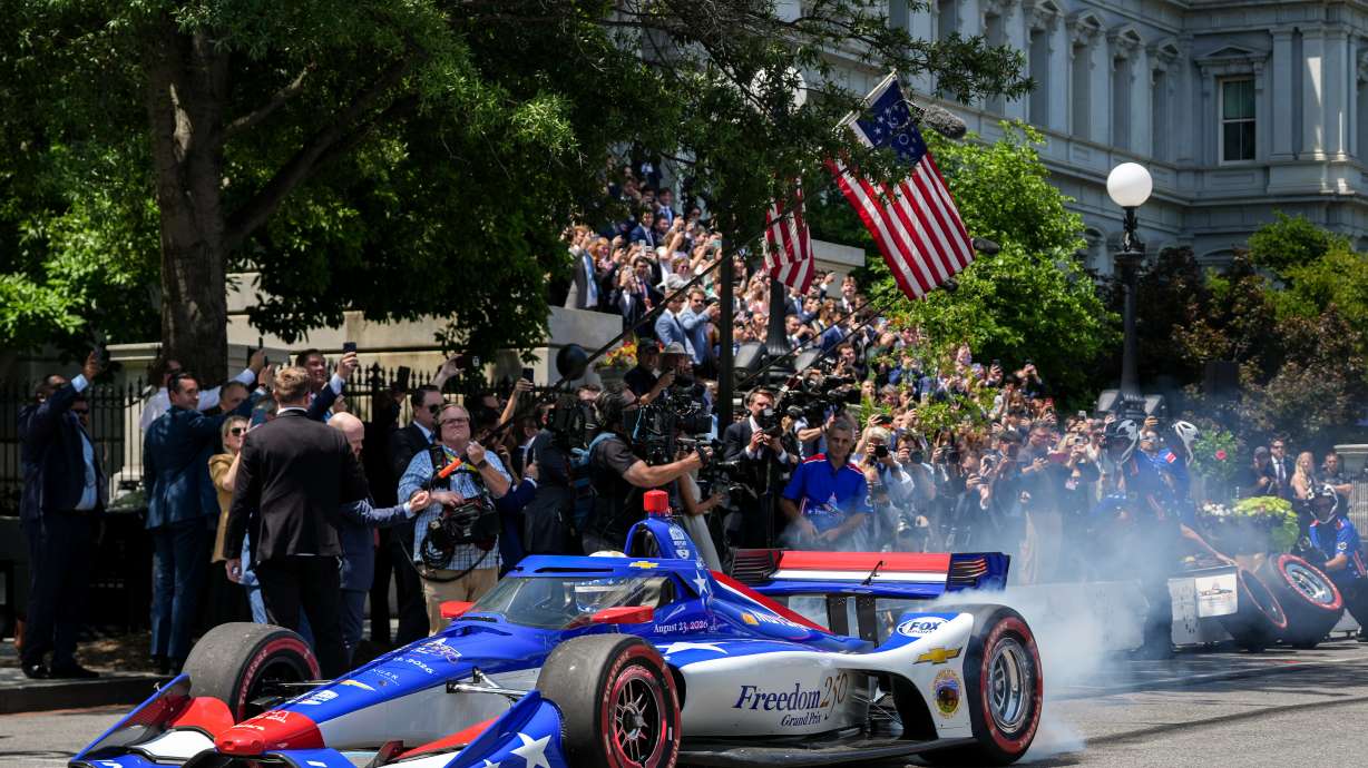 IndyCar Series driver David Malukas drives a race car down West Executive Drive during an event with President Donald Trump to promote the upcoming Freedom 250 Grand Prix auto race, Monday, July 13, 2026, at the White House in Washington.