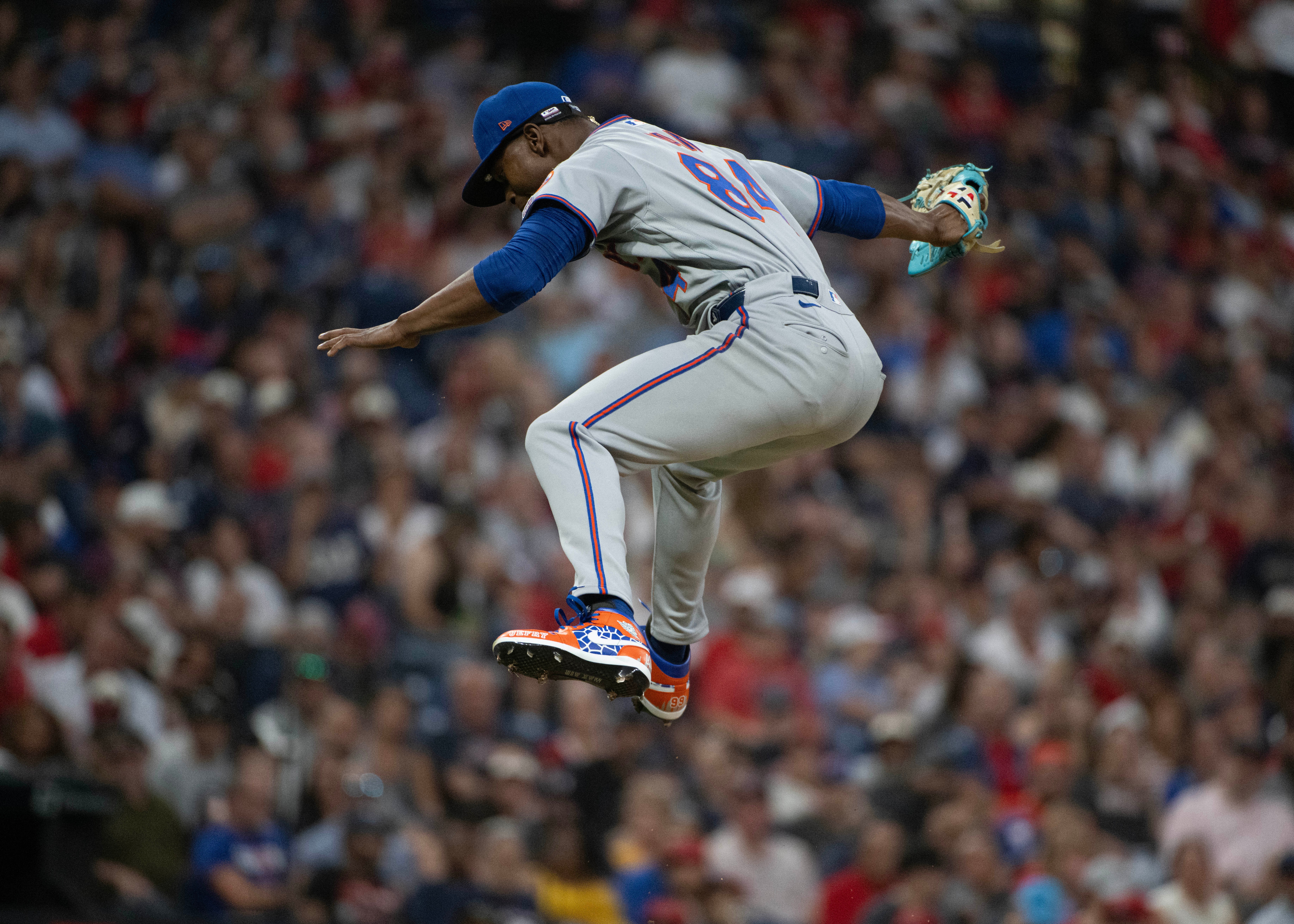 After striking out Cleveland Guardians' Angel Martinez during his Major League debut, New York Mets relief pitcher Jefry Yan reacts during the sixth inning of a baseball game, Wednesday, Aug. 5, 2026, in Cleveland. 