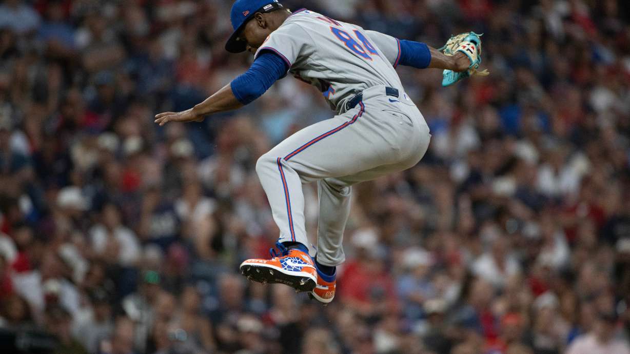 After striking out Cleveland Guardians' Angel Martinez during his Major League debut, New York Mets relief pitcher Jefry Yan reacts during the sixth inning of a baseball game, Wednesday, Aug. 5, 2026, in Cleveland.