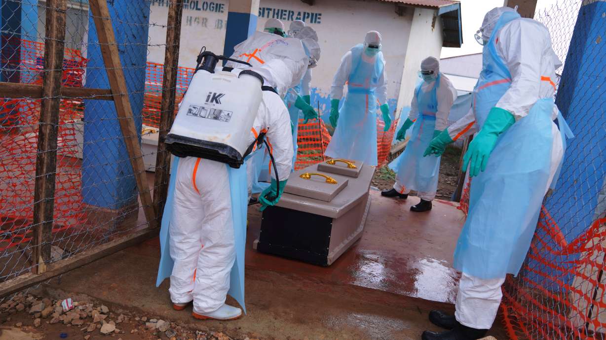Health workers disinfect a coffin of an Ebola victim at Ebola Treatment Center at Bunia General Hospital in Ituri, Congo on July 22.
