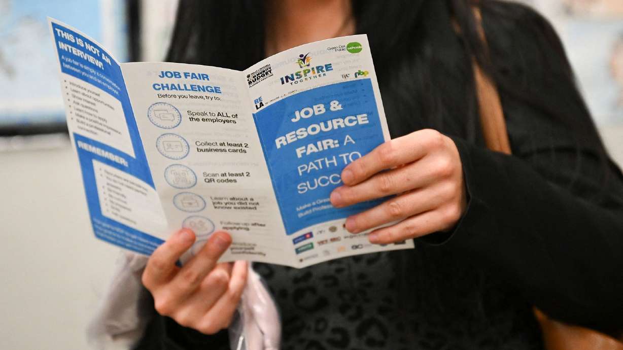 Job seekers wait in line for free resume preparation services as they attend an Inspire Together job and resource fair in Los Angeles on July 29. A lull in teen hiring during the summer could say a lot about the jobs market ahead of Friday's report.