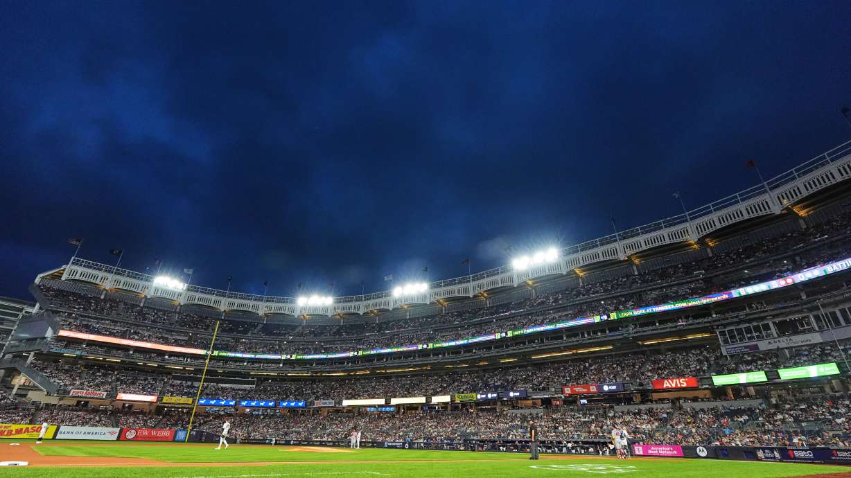 Play is stopped after lights lost power during the first inning of a baseball game between the New York Yankees and the St. Louis Cardinals Wednesday, Aug. 5, 2026, in New York.