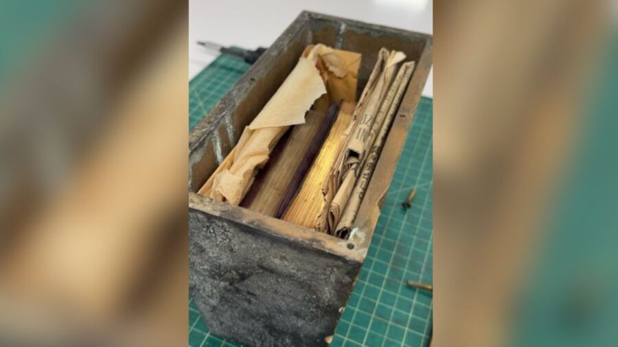 This image shows the contents of a bronze time capsule found within the Japanese Church of Christ in Salt Lake City.