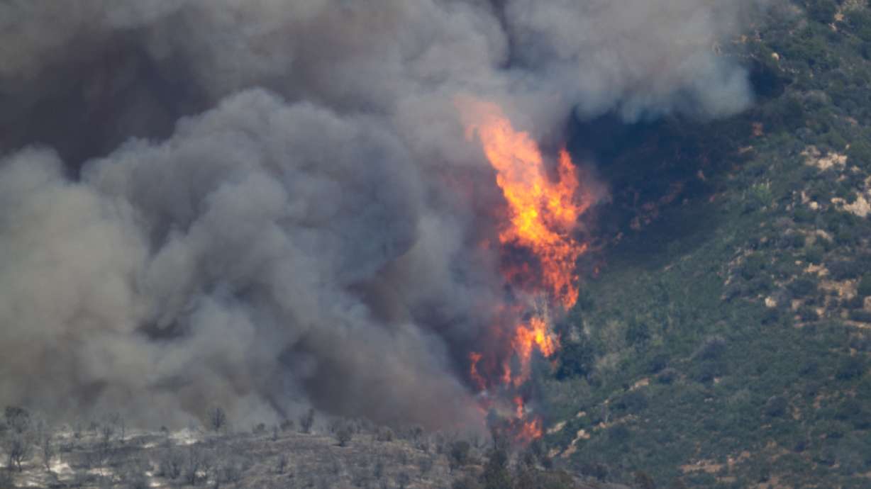 The Widemouth 2 Fire east of Fillmore on Tuesday. Responders who worked to find the bodies of the two firefighters killed in a helicopter crash Friday near the wildfire in central Utah described the treacherous conditions they navigated.