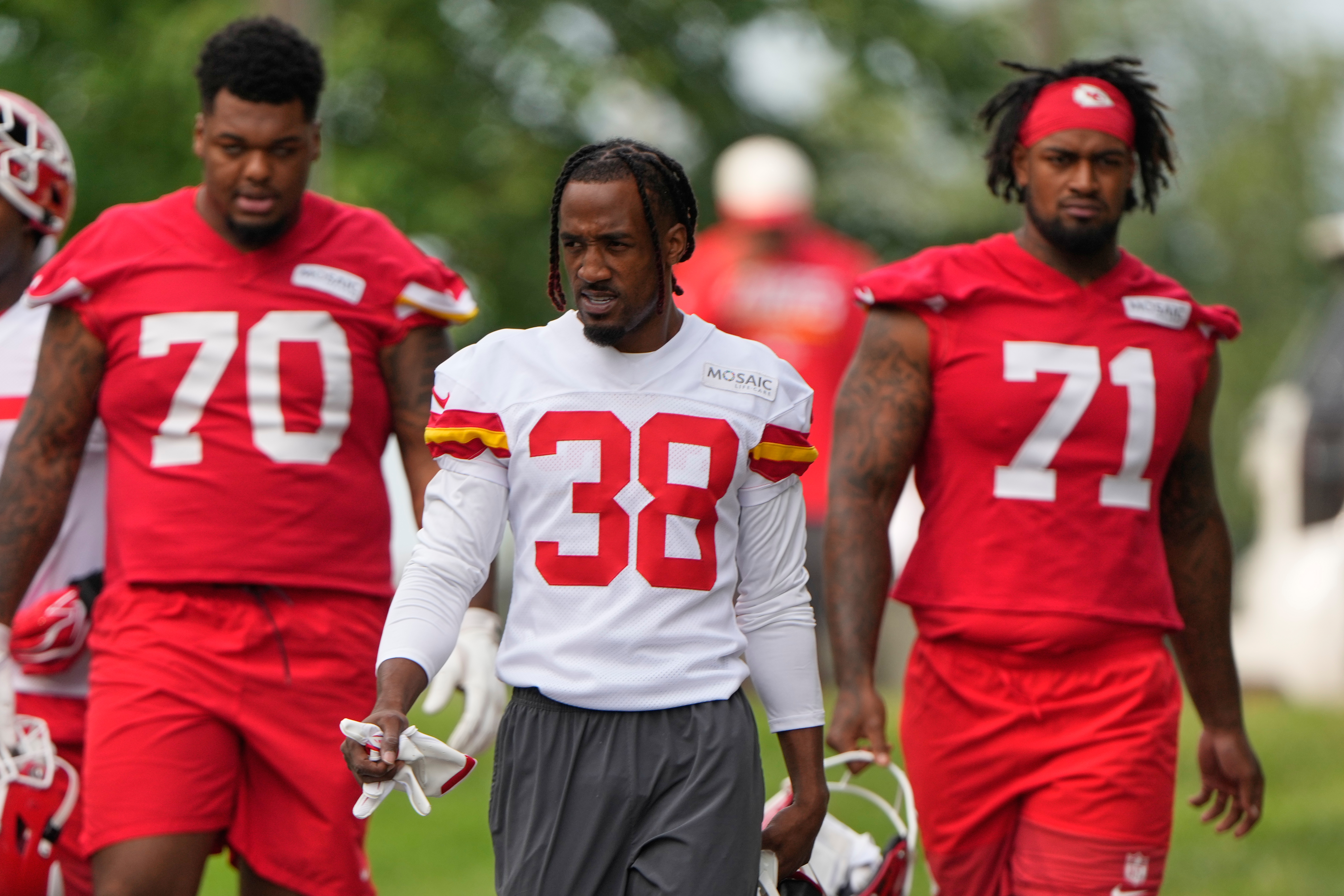 Kansas City Chiefs tackle Kahil Benson (70), cornerback L'Jarius Sneed (38) and tackle Josh Simmons (71) arrive at NFL football training camp Wednesday, July 29, 2026, in St. Joseph, Mo. 