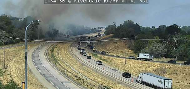 Video shows fire threatening building in Riverdale along I-84