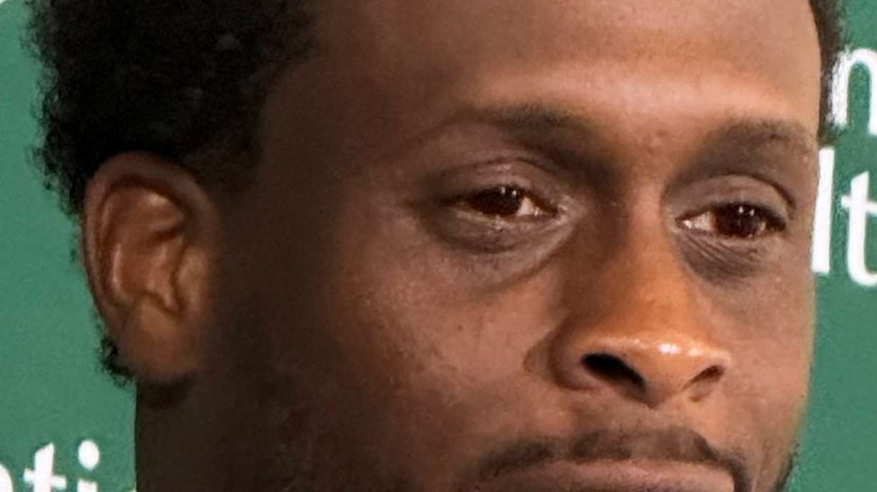New York Jets quarterback Geno Smith, wearing red contact lenses, speaks to reporters after practice at the team’s training facility in Florham Park, N.J., on Thursday, Aug. 6, 2026.