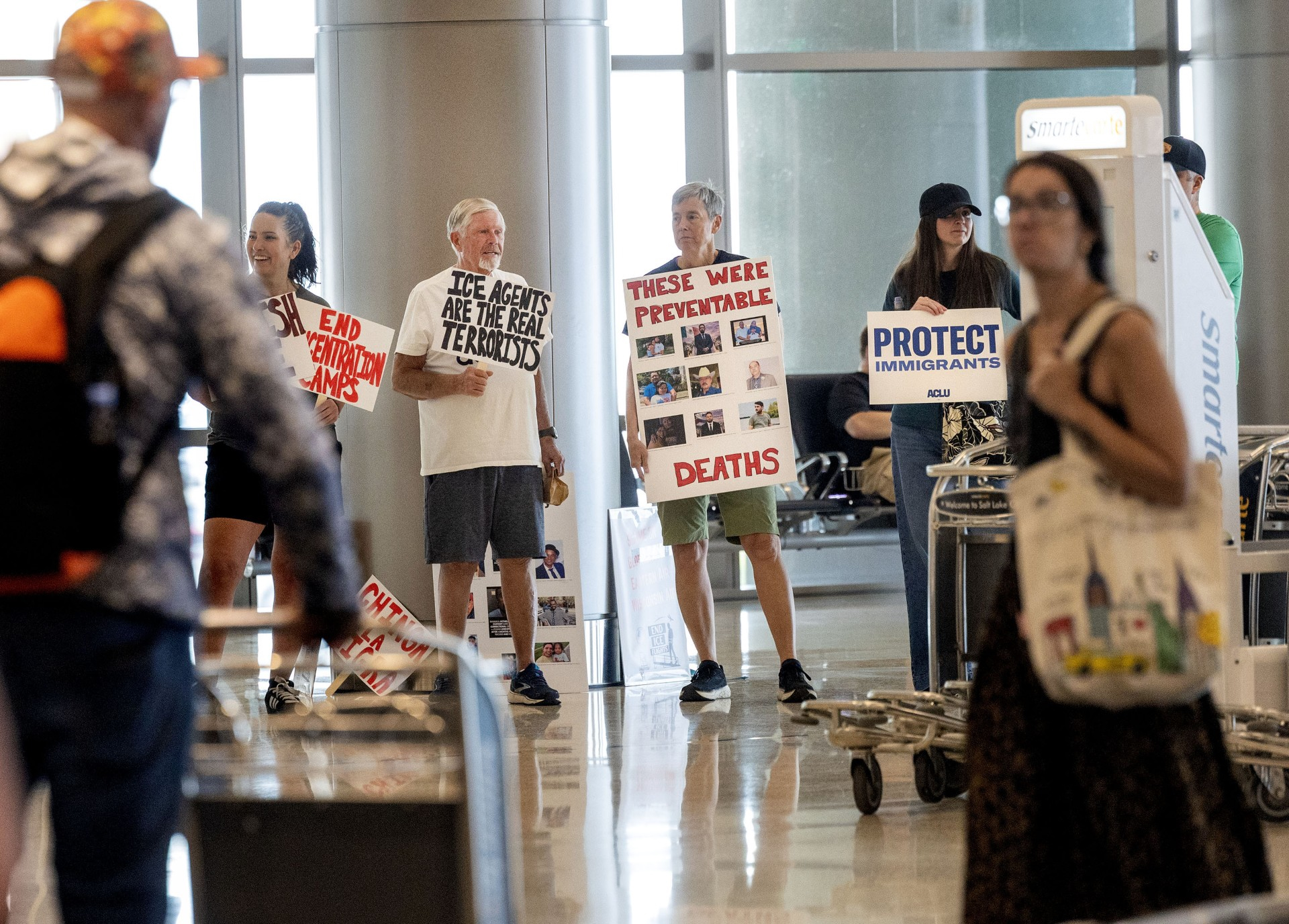 Immigrant advocates picket against immigrant detainee flights at Salt Lake airport