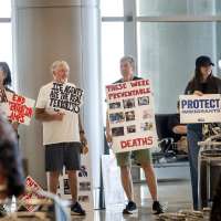 Immigrant advocates picket against immigrant detainee flights at Salt Lake airport