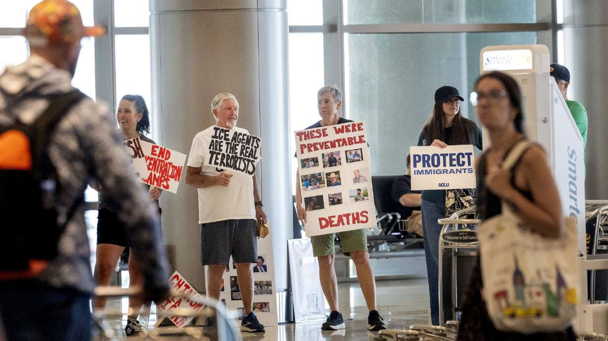 A handful of immigrant advocates gathered at Salt Lake City International airport on Thursday to protest the regular immigrant detainee flights out of the facility.