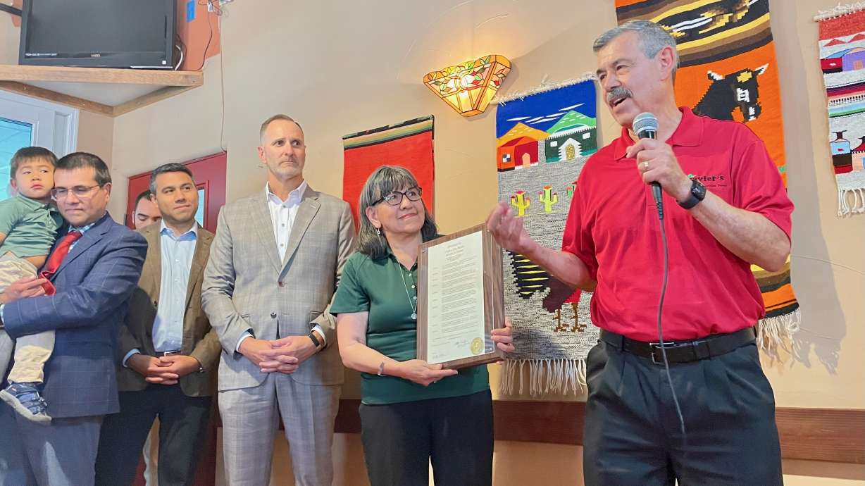 Javier Chavez Sr., right, operator of a small chain of Mexican restaurants, received a key to Ogden on Thursday for his business efforts and contributions to the city. He's pictured at one of his Ogden restaurants at a ceremony marking the moment.