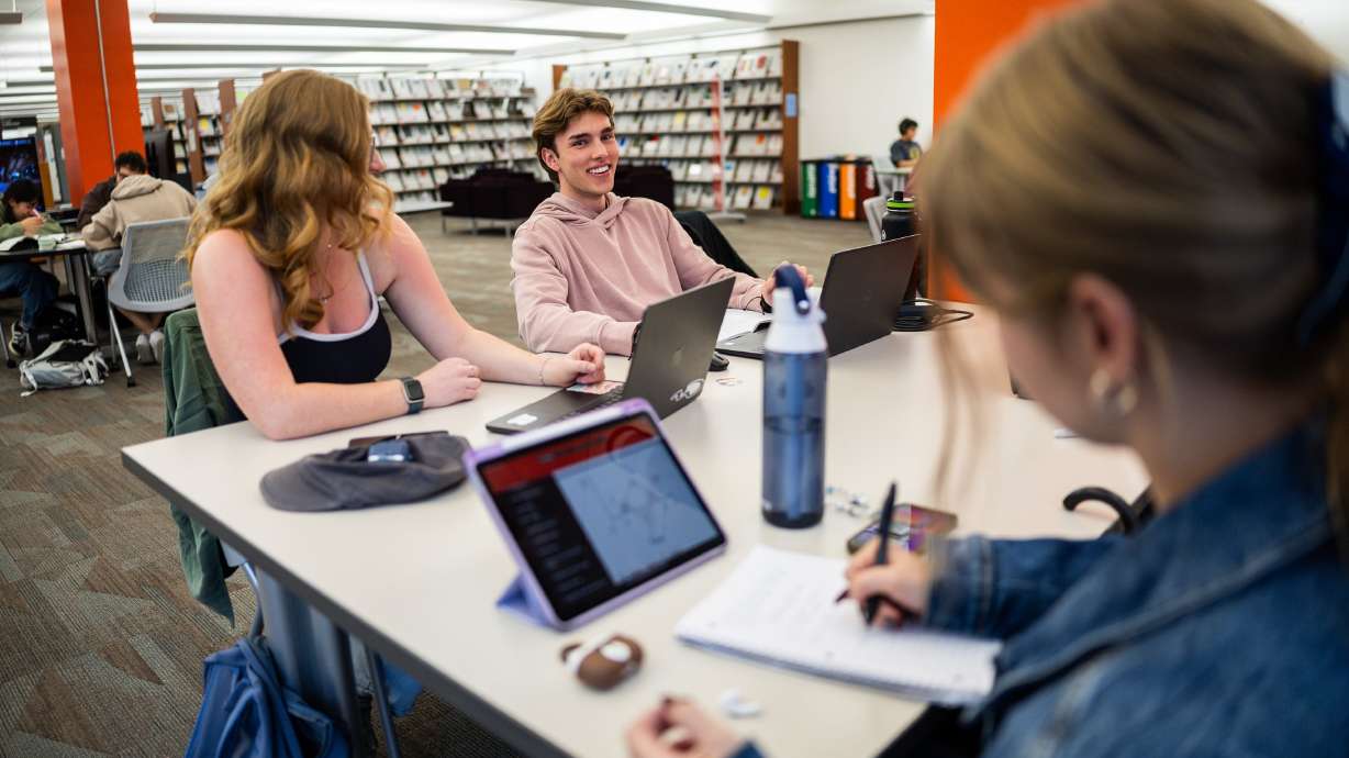 University of Utah students Jenae Watts, 19, Brendan Matern, 18, and Olive Nelson, 20, from left, work at the J. Willard Marriott Library in Salt Lake City on April 1. Just days before the start of a new academic year at most U.S. colleges, Education Secretary Linda McMahon is issuing a "call to action" to university presidents and board members