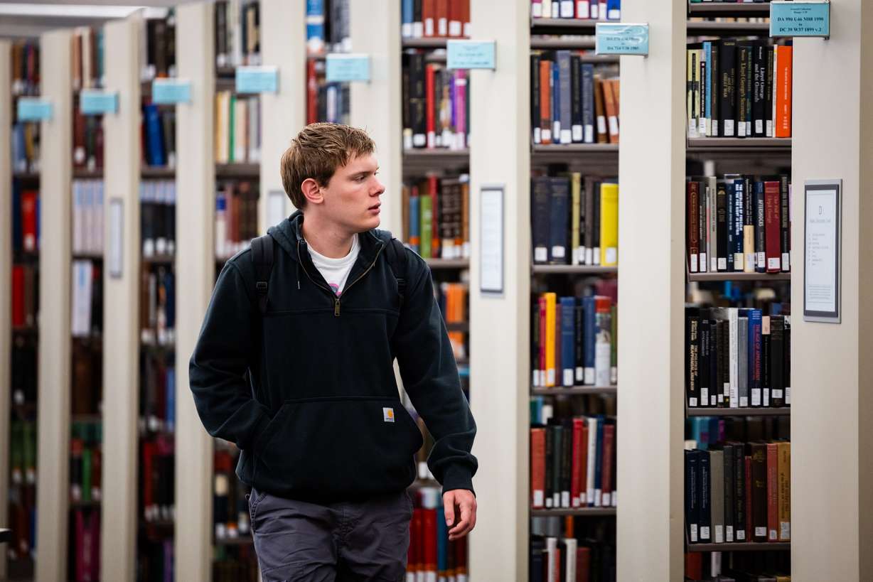 University of Utah student Michael Williams, 21, walks through the J. Willard Marriott Library in Salt Lake City on April 1. Just days before the start of a new academic year at most U.S. colleges, Education Secretary Linda McMahon is issuing a "call to action" to university presidents and board members.
