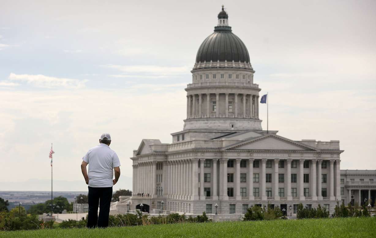 A Venezuelan refugee, who would like to be identified as Norberto, poses for a portrait overlooking the Capitol in Salt Lake City on July 22.