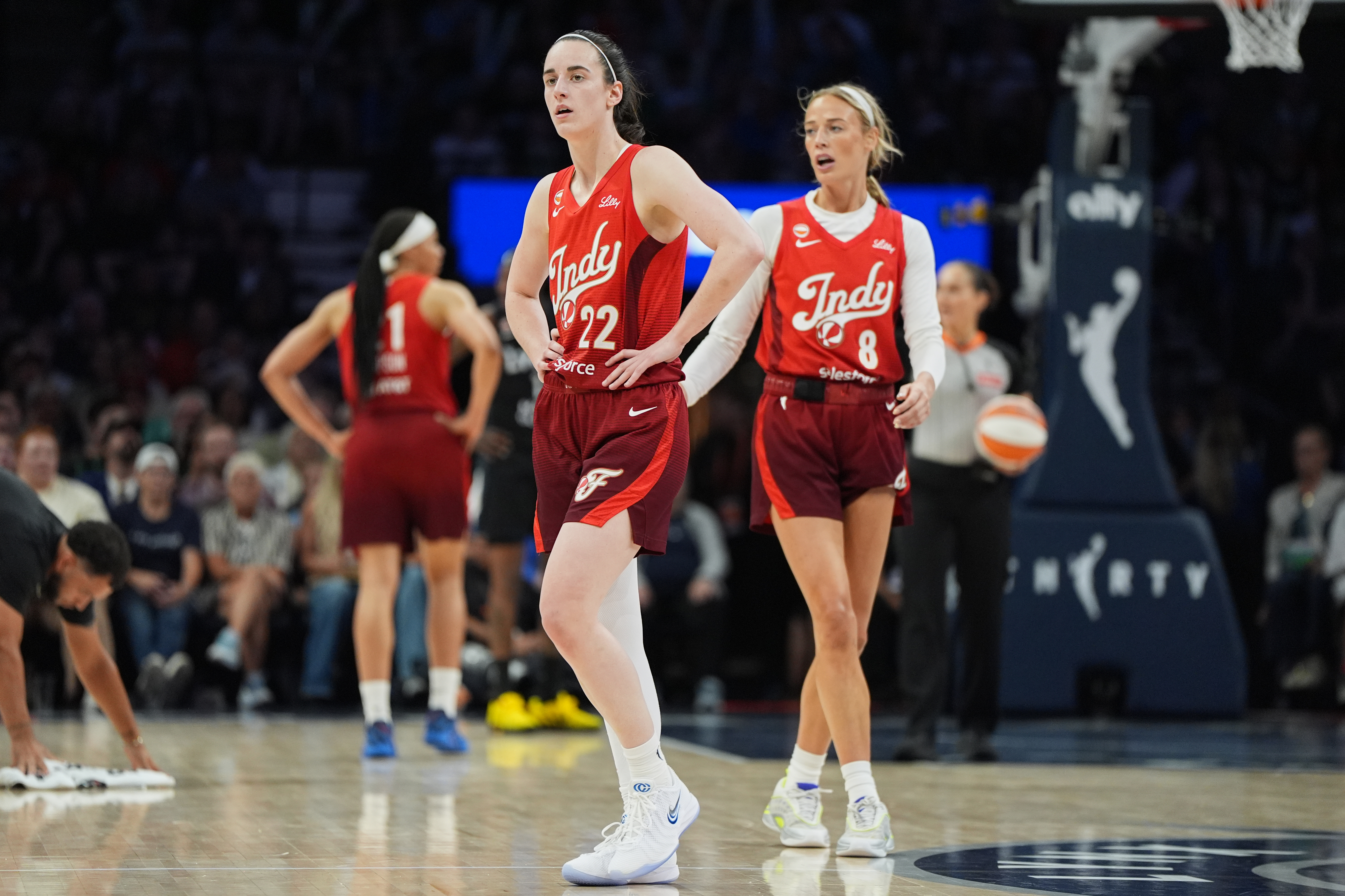 Indiana Fever guards Caitlin Clark (22) and Sophie Cunningham (8) wait for play to resume during the second half of a WNBA basketball game against the Minnesota Lynx, Sunday, Aug. 2, 2026, in Minneapolis. 